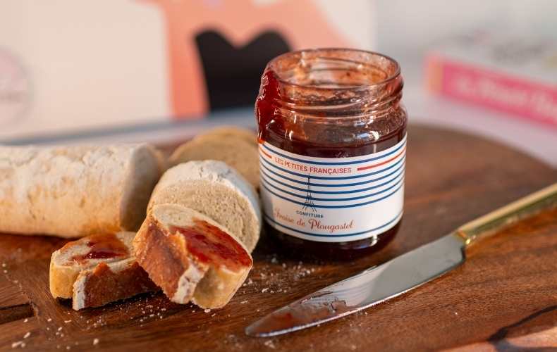 Delicious homemade French strawberry jam served in a glass jar